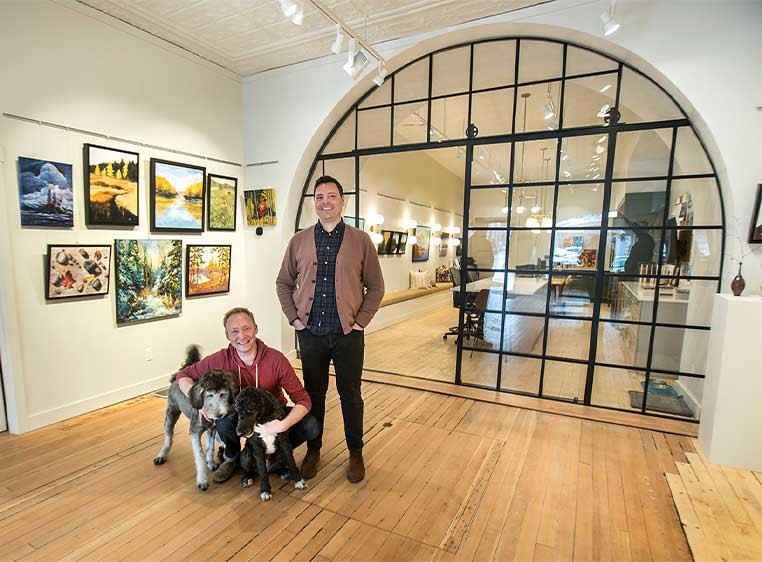 Business owners posing for a photo in the showroom